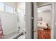 Well-lit bathroom featuring a shower-over-tub combination and a window at 3829 Eagleflight Ln, Land O Lakes, FL 34639