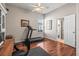 Bedroom featuring wood floors, a ceiling fan, and neutral paint at 3829 Eagleflight Ln, Land O Lakes, FL 34639