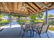 Inviting boat dock with seating and dining, perfect for enjoying waterfront views and outdoor gatherings at 3829 Eagleflight Ln, Land O Lakes, FL 34639