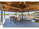 Spacious boat dock featuring a covered seating area and boat lift, ideal for lakeside entertaining at 3829 Eagleflight Ln, Land O Lakes, FL 34639