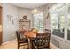 Dining area with wood floors, window blinds, and decorative light fixture at 3829 Eagleflight Ln, Land O Lakes, FL 34639