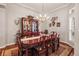 Formal dining room with chandelier lighting and an expansive table perfect for hosting at 3829 Eagleflight Ln, Land O Lakes, FL 34639