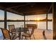 Covered dock overlooking the water has a table with chairs and swing perfect for entertaining and relaxing at 3829 Eagleflight Ln, Land O Lakes, FL 34639