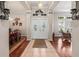 Welcoming entryway featuring a double door entry, hardwood floors, and lots of natural light at 3829 Eagleflight Ln, Land O Lakes, FL 34639