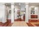 Elegant foyer with tile and wood floors, decorative columns, and built in cabinet at 3829 Eagleflight Ln, Land O Lakes, FL 34639