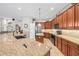 Gourmet kitchen with granite countertops, a center island, and stainless steel appliances at 3829 Eagleflight Ln, Land O Lakes, FL 34639