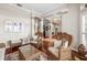 Inviting living room with wicker furniture, hardwood floors, and neutral paint palette at 3829 Eagleflight Ln, Land O Lakes, FL 34639