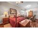 Spacious main bedroom features hardwood floors and seating area at 3829 Eagleflight Ln, Land O Lakes, FL 34639