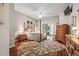 Spacious main bedroom boasts hardwood floors and a view to the pool at 3829 Eagleflight Ln, Land O Lakes, FL 34639