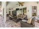 Comfortable outdoor patio with plush seating and a view of the tranquil lake at 3829 Eagleflight Ln, Land O Lakes, FL 34639
