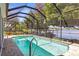 Inviting screened pool area with waterfront views, perfect for relaxation and enjoying the beautiful scenery at 3829 Eagleflight Ln, Land O Lakes, FL 34639