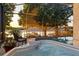 Screened in pool and hot tub with lake views and ample space for lounge chairs at 3829 Eagleflight Ln, Land O Lakes, FL 34639