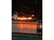 Stunning lake sunset view from the property with a dock and lush surroundings at 3829 Eagleflight Ln, Land O Lakes, FL 34639
