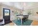 Bright dining room featuring hardwood floors, large windows and a modern chandelier at 4007 W Bay Villa Ave, Tampa, FL 33611
