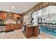 Kitchen with stainless appliances, center island, and open layout to the dining room at 4007 W Bay Villa Ave, Tampa, FL 33611