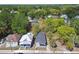 Aerial view of a neighborhood showcasing a home with a well-manicured lawn and mature trees at 412 E Columbus Dr, Tampa, FL 33602