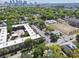 Urban landscape featuring diverse buildings, lush trees, and a view of the city skyline at 412 E Columbus Dr, Tampa, FL 33602