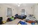 Spacious bedroom showcasing multiple beds, playful decor, and ample natural light at 412 E Columbus Dr, Tampa, FL 33602