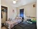 Bedroom featuring two beds, neutral walls, and window providing soft natural light at 412 E Columbus Dr, Tampa, FL 33602