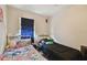 Comfortable bedroom featuring two beds, bright window and a peaceful ambiance at 412 E Columbus Dr, Tampa, FL 33602