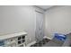 Small bedroom featuring simple decor, and comfortable gray futon at 412 E Columbus Dr, Tampa, FL 33602