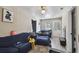 Inviting living room with natural lighting, comfy furniture, and open layout to other rooms at 412 E Columbus Dr, Tampa, FL 33602