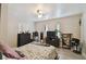 Cozy main bedroom with a ceiling fan and large dresser at 412 E Columbus Dr, Tampa, FL 33602