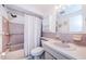 Bathroom with a combination shower and tub and a pink tiled wall at 4242 Sheldon Pl, New Port Richey, FL 34652