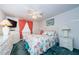 Bedroom featuring wicker furniture, a ceiling fan, and coastal-themed decor at 4242 Sheldon Pl, New Port Richey, FL 34652