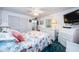 Bedroom with wicker dresser, accent pillows, and a view of closet and doorway at 4242 Sheldon Pl, New Port Richey, FL 34652