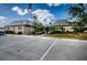 Well-maintained building exterior featuring a parking lot, landscaping, and an American flag flying on a clear day at 4242 Sheldon Pl, New Port Richey, FL 34652