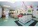 Large community clubhouse featuring lounge seating, a pool table, and access to the pool area at 4242 Sheldon Pl, New Port Richey, FL 34652