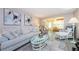 Bright living room featuring a comfortable couch, stylish coffee table, and modern decor at 4242 Sheldon Pl, New Port Richey, FL 34652