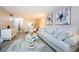 Open-concept living space with a living room flowing into the dining area with modern decor at 4242 Sheldon Pl, New Port Richey, FL 34652