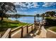 Scenic waterfront view with a wooden dock and a tranquil lake setting at 4242 Sheldon Pl, New Port Richey, FL 34652
