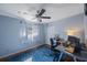 Bedroom with built-in closet, wood floor and ceiling fan at 4926 Cardinal Trl, Palm Harbor, FL 34683