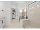 Bright bathroom featuring a glass shower, double vanity, and walk-in closet at 4951 Ribbon Rock Cv, Lakewood Ranch, FL 34211
