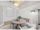 Charming dining area boasts a round table, bench seating and stylish lighting for cozy meals at 4951 Ribbon Rock Cv, Lakewood Ranch, FL 34211
