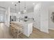 Bright, open kitchen with large island, modern pendant lighting, and stainless steel appliances at 4951 Ribbon Rock Cv, Lakewood Ranch, FL 34211