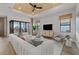 Bright living room features a ceiling fan, white sofa, and hardwood floors at 4951 Ribbon Rock Cv, Lakewood Ranch, FL 34211