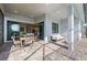 Covered outdoor patio with stylish seating and a dining area, perfect for relaxation and entertainment at 4951 Ribbon Rock Cv, Lakewood Ranch, FL 34211