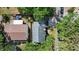 Aerial view of property showing the roof, yard, and surrounding greenery at 5401 S Russell St, Tampa, FL 33611