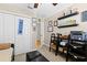 Cozy bedroom featuring a ceiling fan, walk-in closet, and shelving at 5401 S Russell St, Tampa, FL 33611