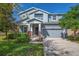 Charming two-story home with landscaped yard, covered porch, and two-car garage at 5825 Jasper Glen Dr, Lithia, FL 33547