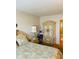 Ornate armoire and side tables compliment this cozy bedroom with attached bathroom at 6020 Shore S Blvd # 903, Gulfport, FL 33707