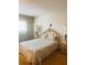 Comfortable bedroom with ornate details, bedside tables, and light filtering curtains at 6020 Shore S Blvd # 903, Gulfport, FL 33707