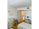 Bright bedroom with closet space, dresser, and sunny yellow carpet at 6020 Shore S Blvd # 903, Gulfport, FL 33707