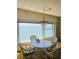 Dining area featuring water views, comfortable seating, and chandelier lighting at 6020 Shore S Blvd # 903, Gulfport, FL 33707