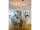 A traditionally decorated dining room area features chandelier lighting and adjacent cabinet at 6020 Shore S Blvd # 903, Gulfport, FL 33707