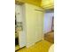 Kitchen area with tile backsplash, linoleum flooring, and yellow countertops at 6020 Shore S Blvd # 903, Gulfport, FL 33707